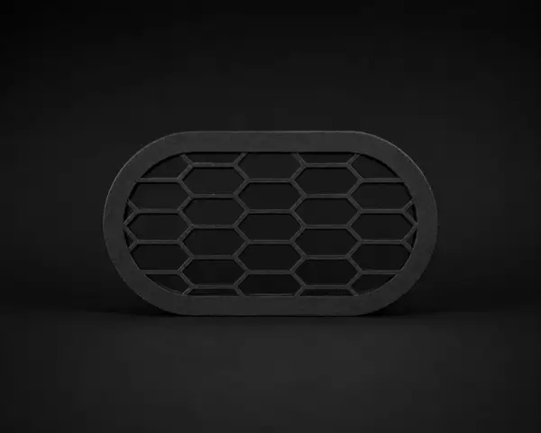 BMW_Rear_Bumper_Vent_universal Schwarzer Rear Bumper Vent mit Wabenstruktur auf dunklem Studiohintergrund